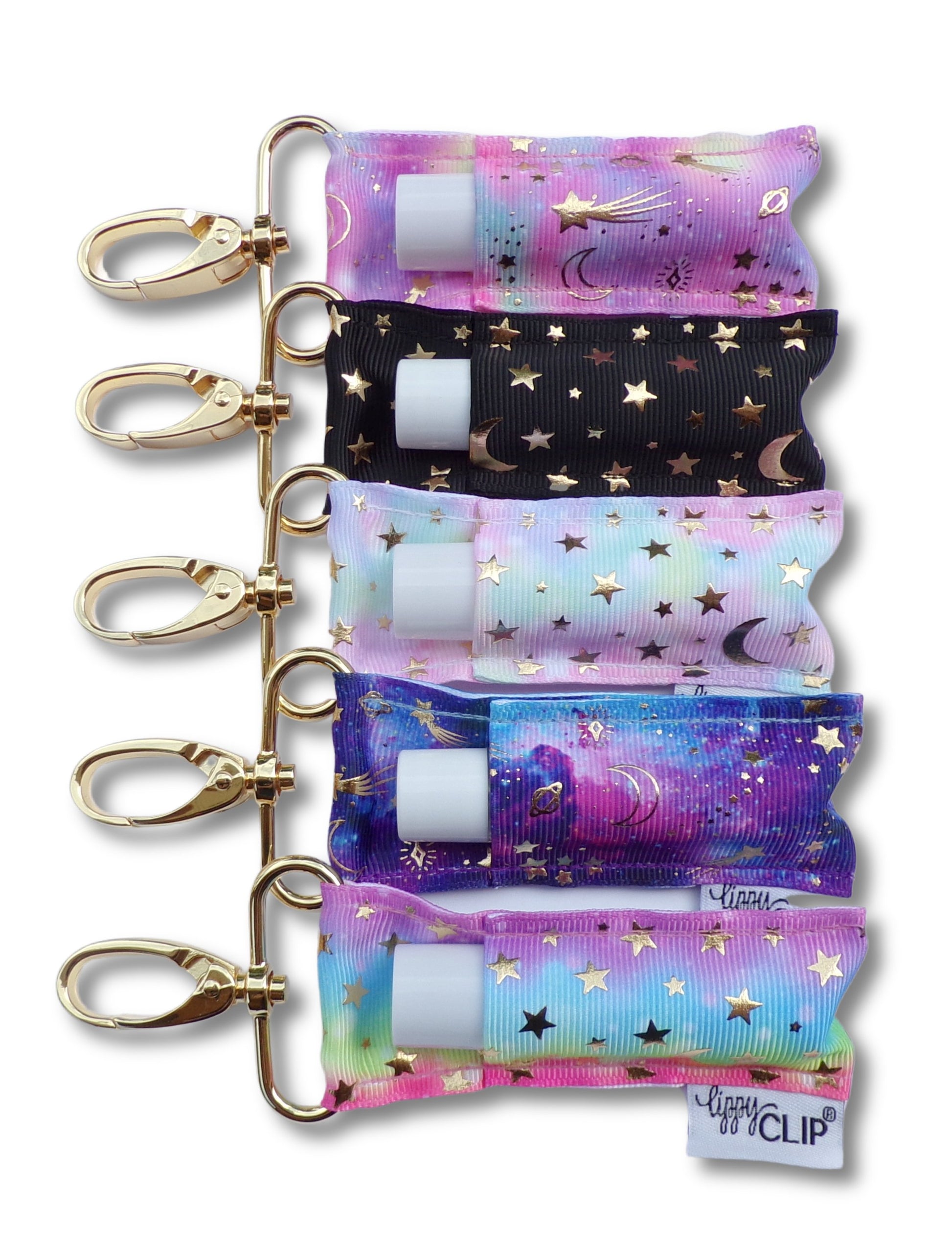Five LippyClips with gold stars and moons stacked vertically on a white background